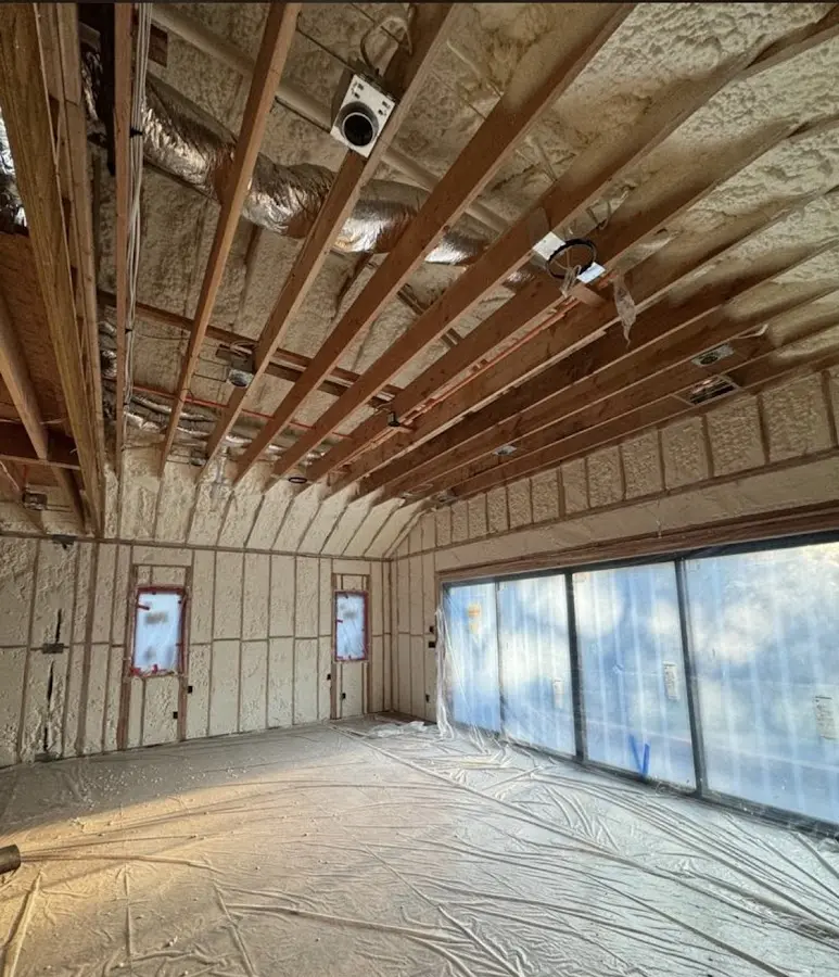 Interior walls and ceiling insulated with spray foam during new construction in West St. Paul